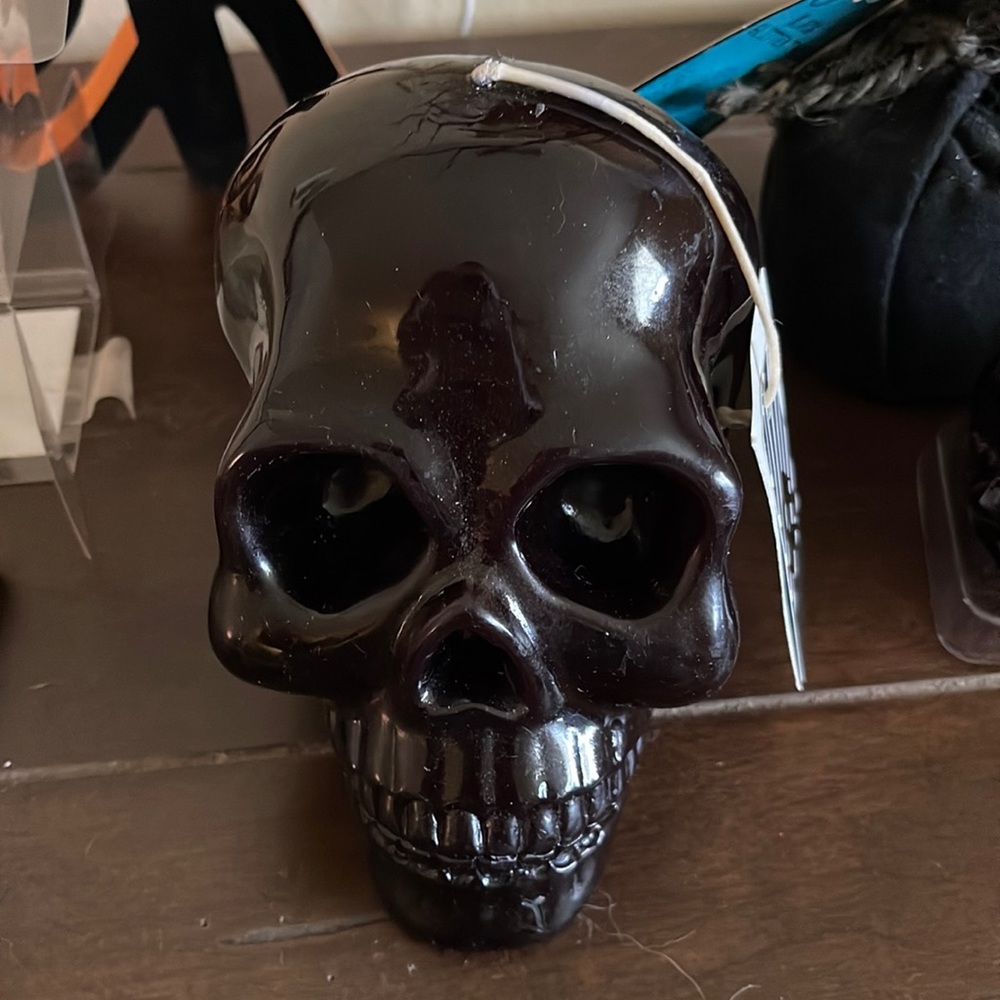 Black painted skull candle